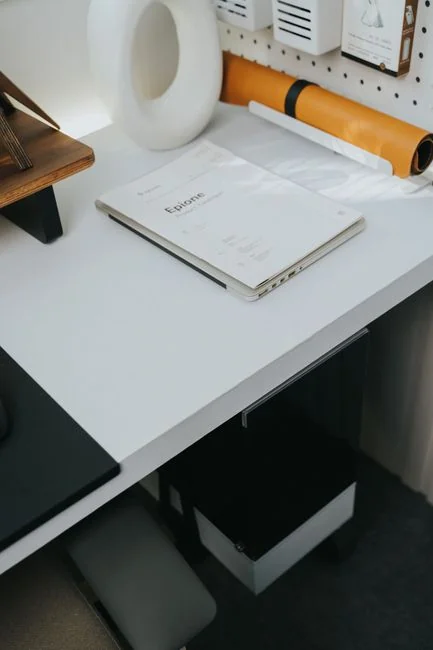 A modern computer screen displaying web design work, showcasing creative visuals in a workspace.